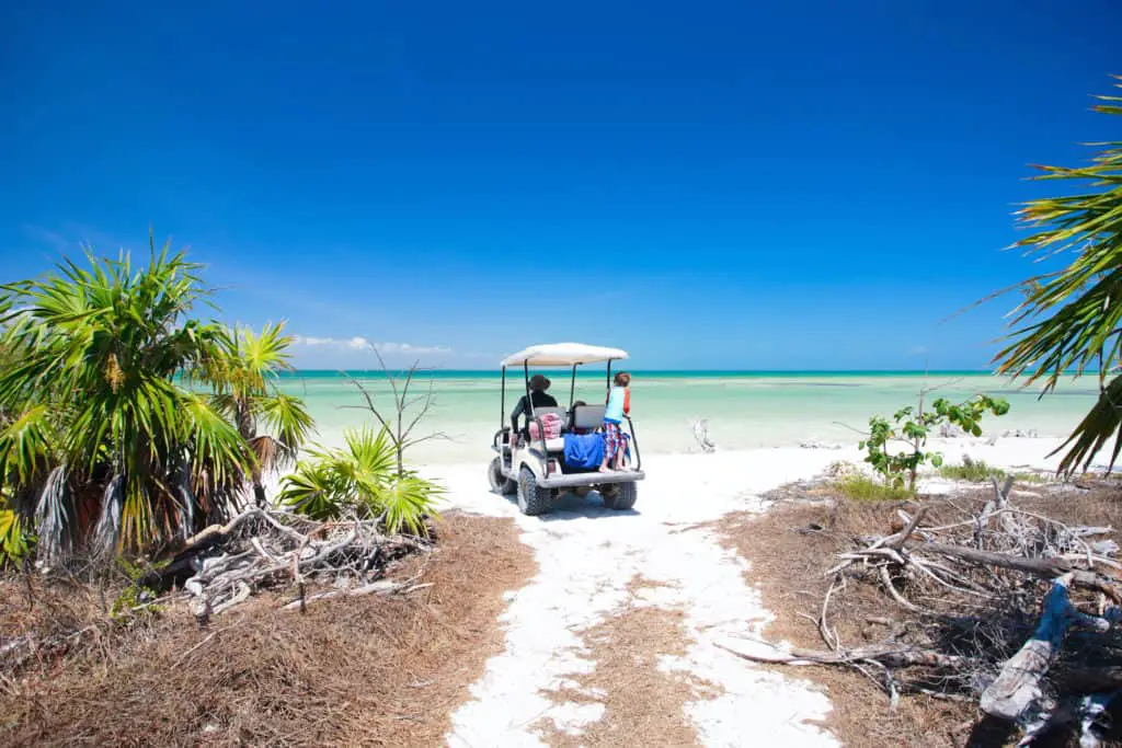 secluded beach with golf cart in florida